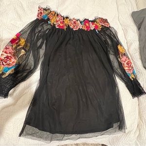 Vintage tunic with black sheer tool and colorful flowers.